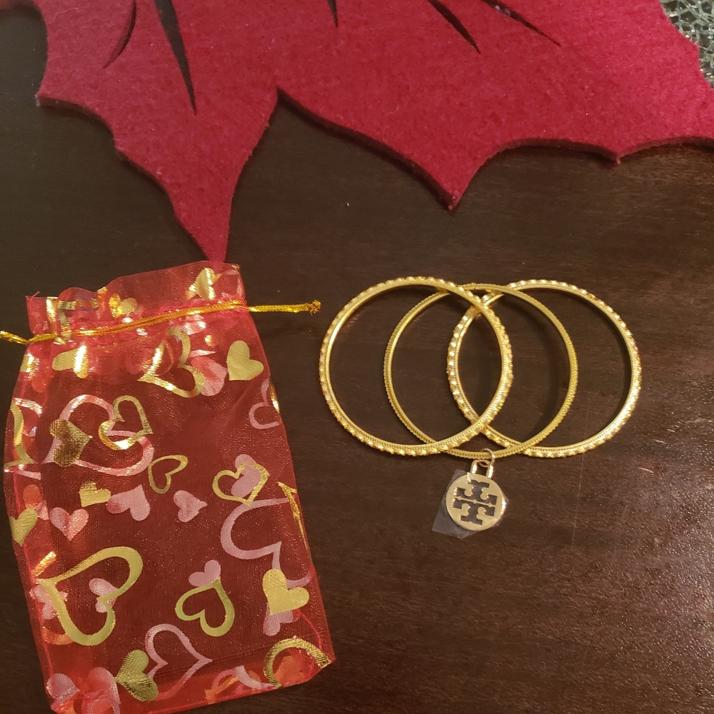 Tory Burch gold ocean wave bangles